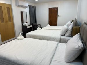 Room with 3 beds